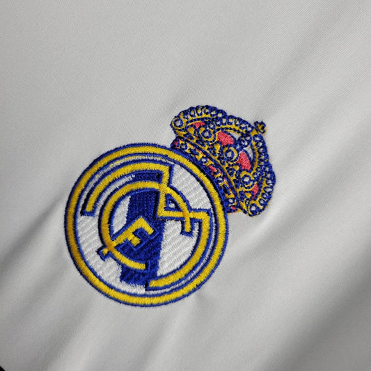 Embroidered logo on a gray fabric background real madrid