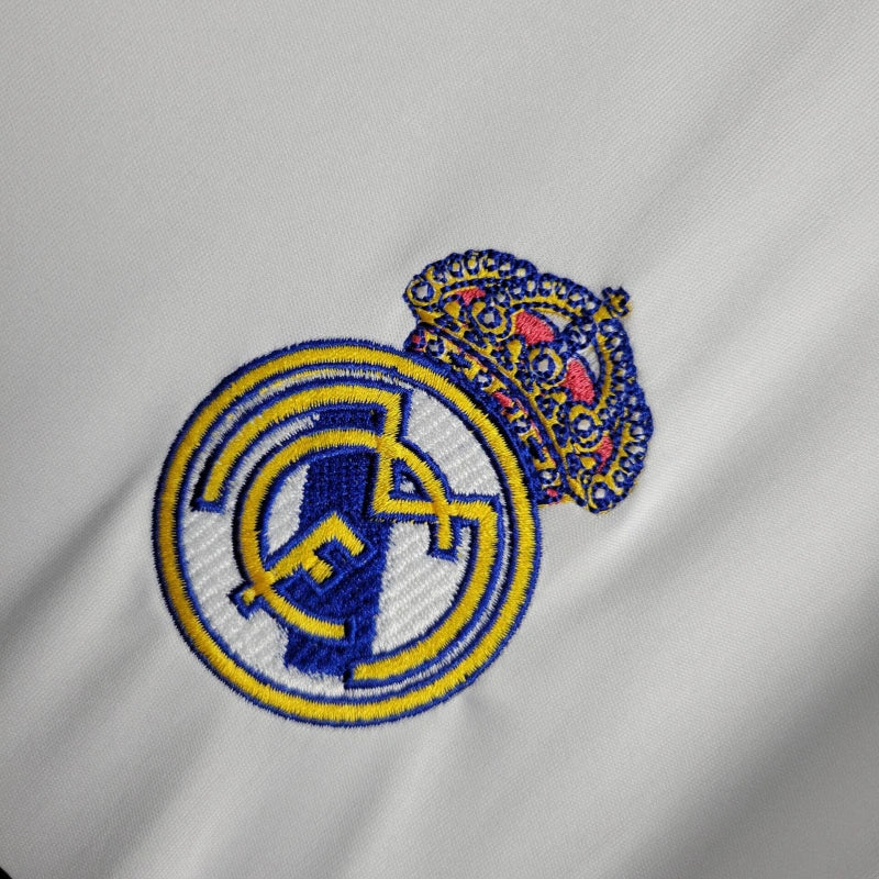 Embroidered logo on a gray fabric background real madrid