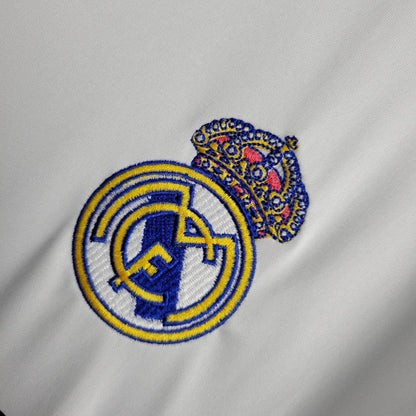 Embroidered logo on a gray fabric background real madrid