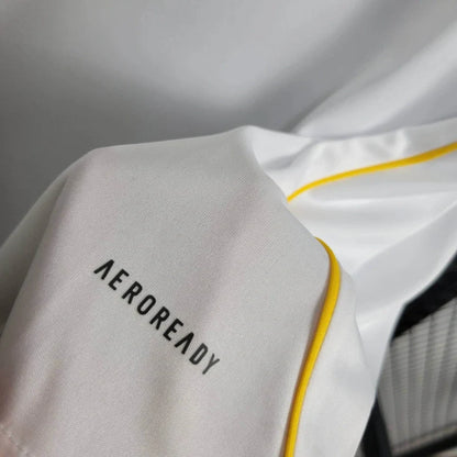 Close-up of a fabric with 'AEROREADY' text on a white background