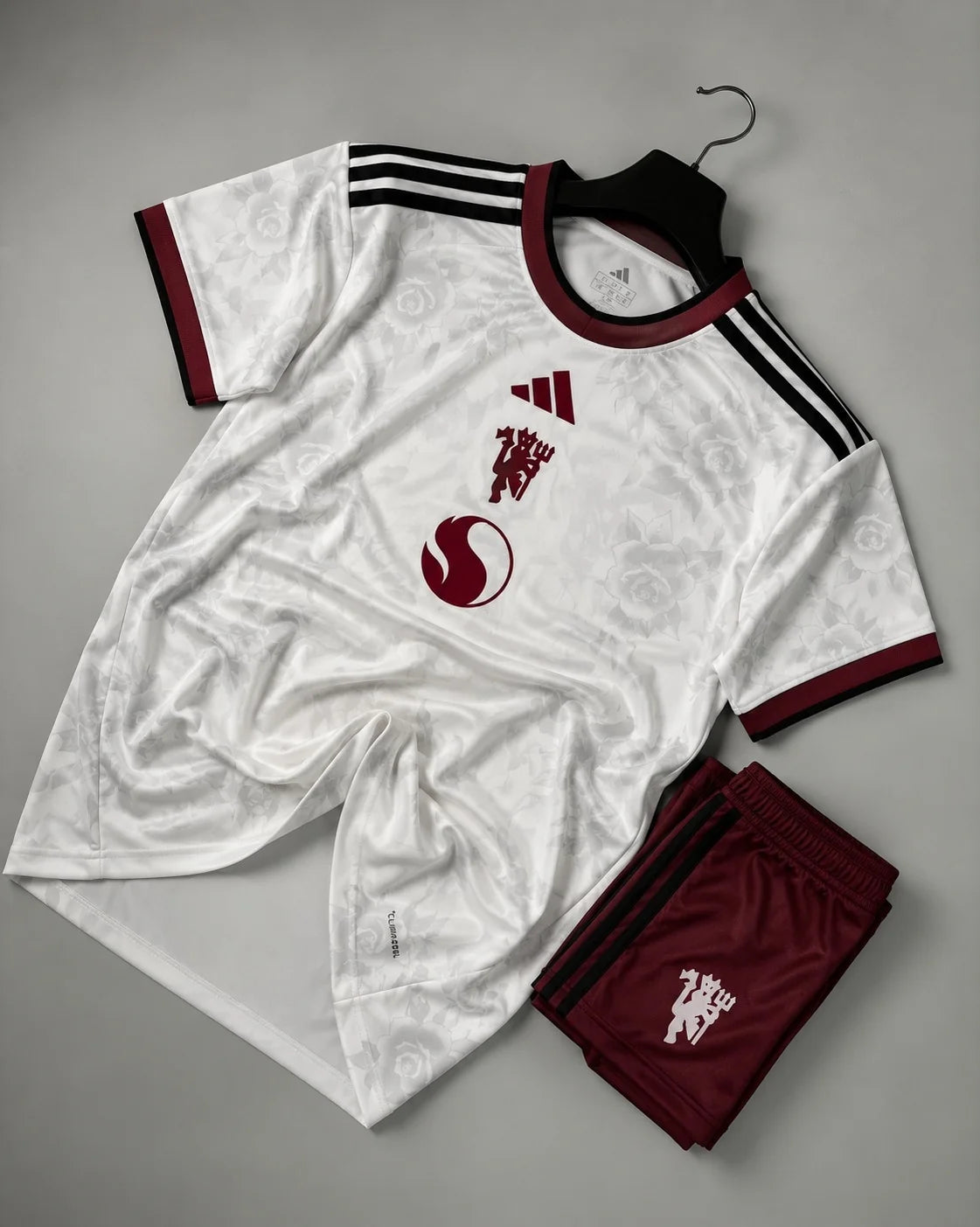 Manchester United 2026-27 Third Jersey Set – Ivory with Lancashire rose pattern and dark green Jungle Ink Adidas stripes