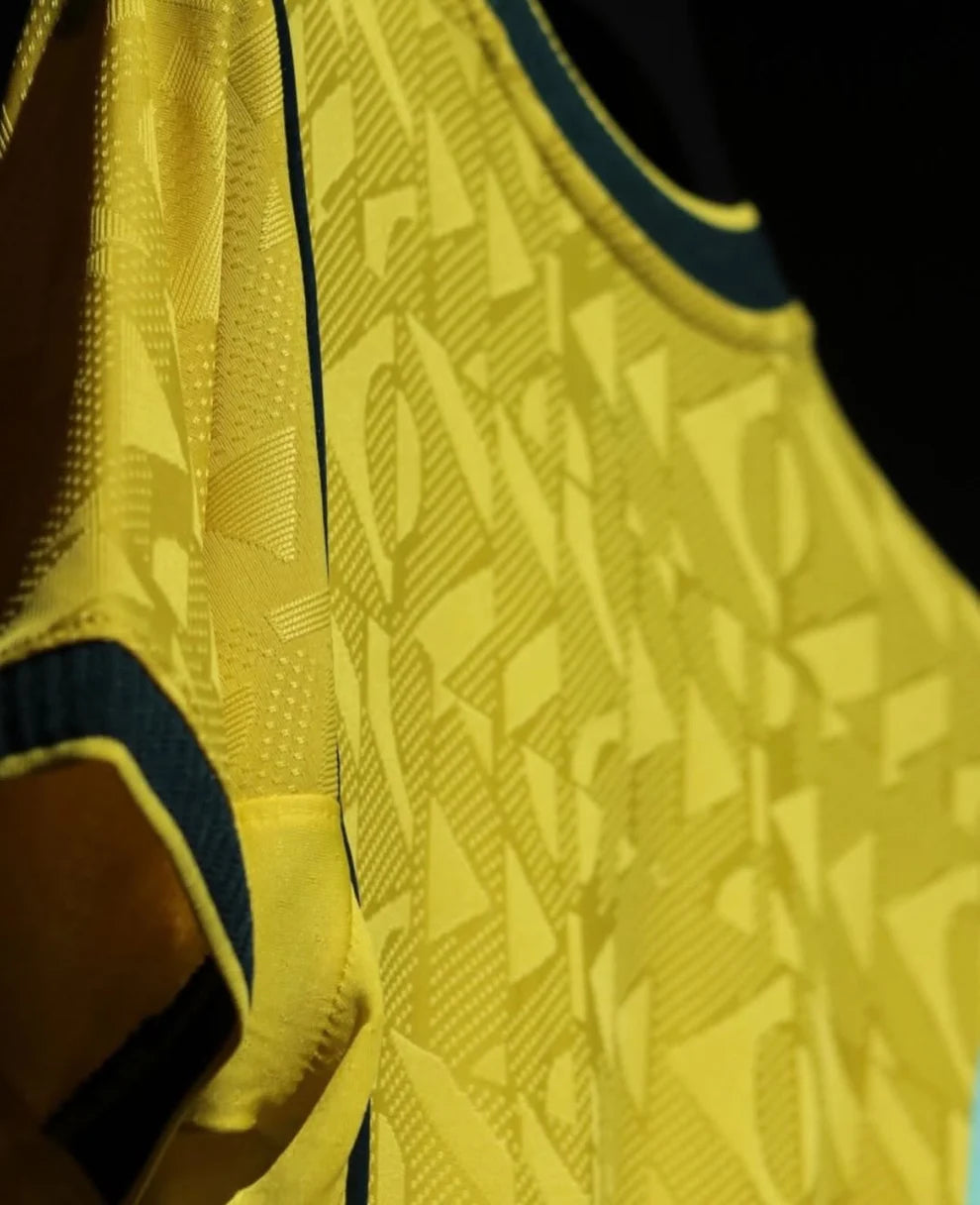 Close-up of a yellow sports jersey with a pattern